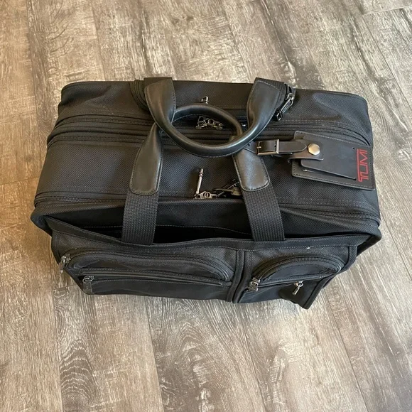 Black Tumi wheeled briefcase/carryon